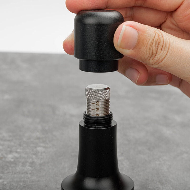 What are the benefits of using a spring loaded coffee tamper ?